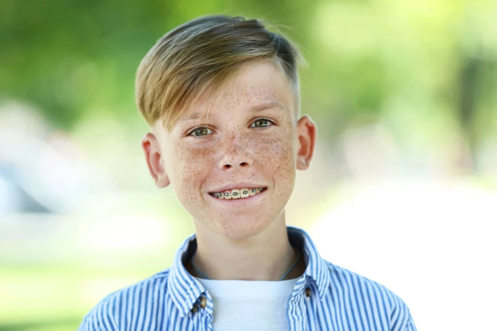 boy smiling after visiting his orthodontist west palm beach 