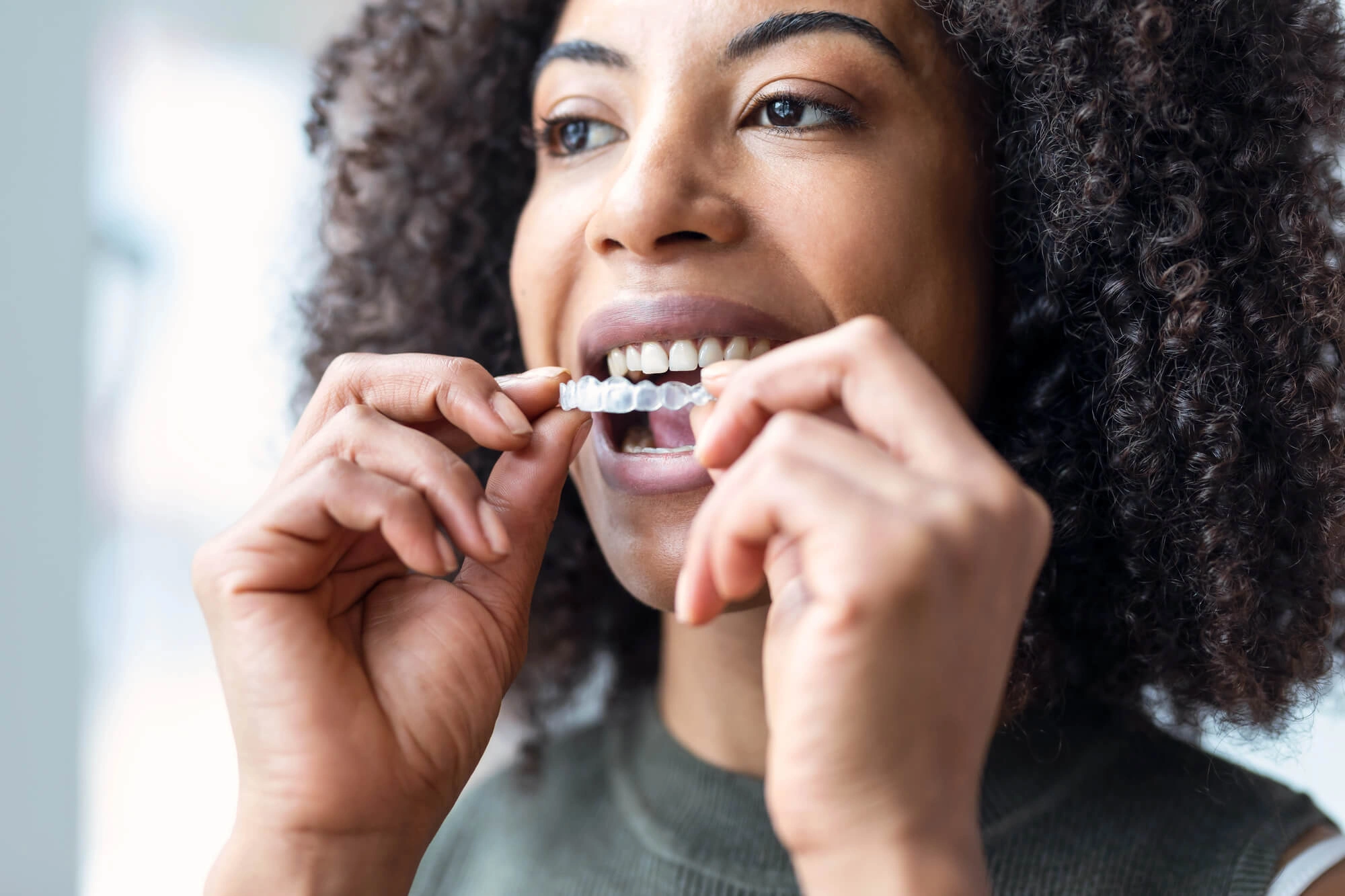 woman about to wear her invisalign west palm beach