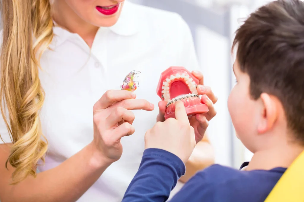 Orthodontists in Forest Hill explaining braces to young patient