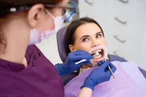 Orthodontists in Forest Hill performing detailed oral exam with dental mirror and tools