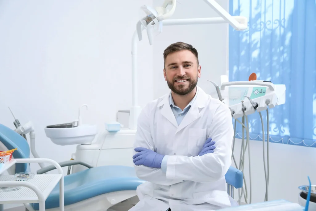 Professional team of orthodontists in Forest Hill smiling in modern clinic office