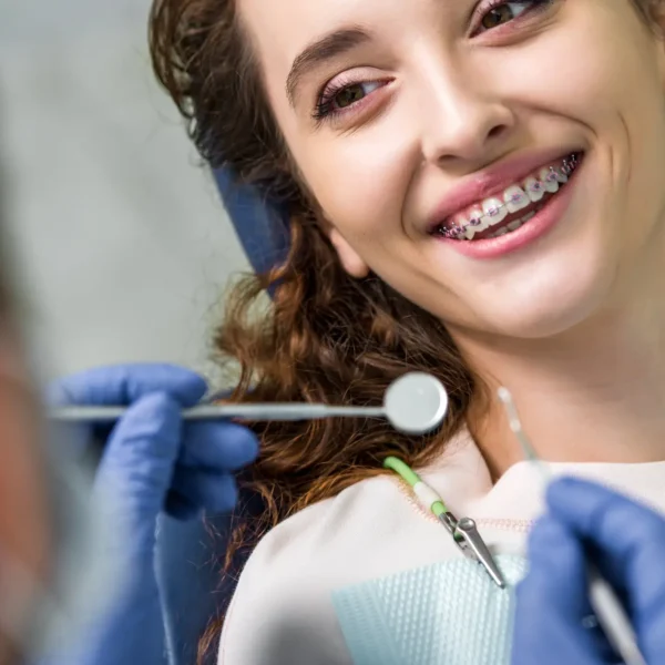 Woman Smiling During Braces West Palm Beach Exam