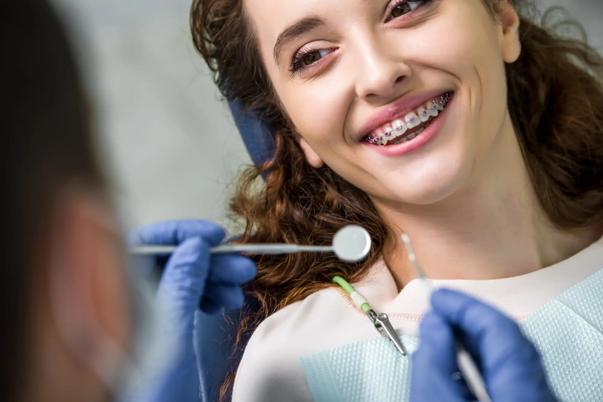 Woman Smiling During Braces West Palm Beach Exam