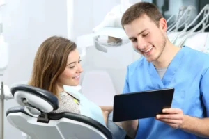 Patient talking with orthodontists in Forest Hill about dental care